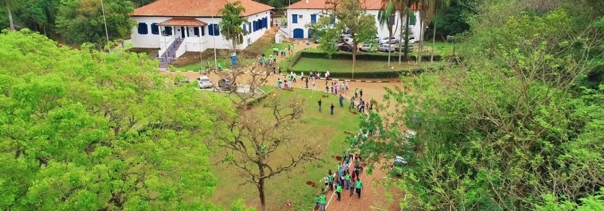 Aerial photo of the Paulinia site with people gathered outside.