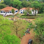 Aerial photo of the Paulinia site with people gathered outside.